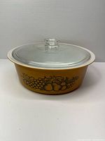 Side view showing Old Orchard fruit motif on casserole body with lid