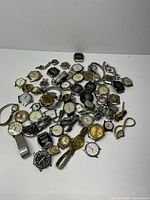 Pile of approximately 60 mixed wristwatches