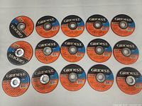 All fifteen Gridest cutting discs laid out label side up