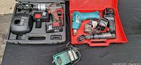 Overview of both opened cases showing Skil drill, charger, batteries and additional tools
