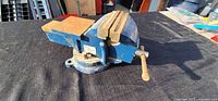 side view of blue swivel bench vise
