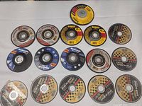 All fifteen abrasive wheels laid out in three rows