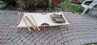 Cot assembled showing canvas bed and wooden frame