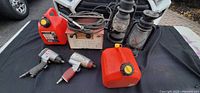 Group shot of welder, air tools, fuel cans, lanterns