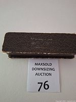 closed brown leatherette presentation box top view