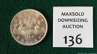 Obverse and lot tag showing coin date