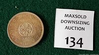 Reverse of 1964 Charlottetown Quebec dollar next to lot marker