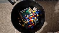 Top view of bucket showing variety of LEGO pieces inside