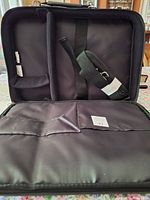 Interior view showing padded compartment and detachable shoulder strap