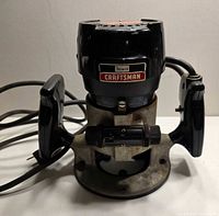 Front view of Craftsman Sears router with handles and base visible