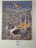 Front cover showing title, slogan, aerial photo of SkyDome and CN Tower