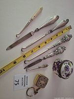 Full set of grooming tools, key fob, china box with measuring tape