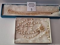 Two boxed faux pearl necklaces overview