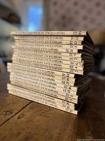 Stack of approximately 20 cream-spined Funk & Wagnalls Wildlife Encyclopedia volumes