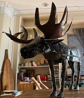 Full side view of metal moose sculpture