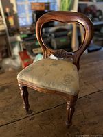 Full view of miniature wooden chair on table