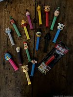 Group shot of all dispensers spread on wooden surface including one sealed blister pack