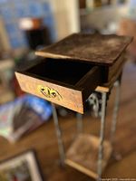 Drawer open showing interior and brass pull