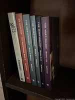 Six books on lower shelf plus bookshelf frame