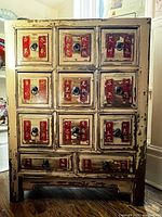 Frontal view of entire apothecary chest showing drawers, color, and wear
