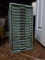 Front view showing 23 slotted drawers