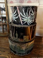 Stacked view of three painted steel drums