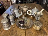 Group shot of all metalware items on table