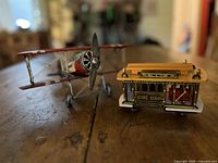 Biplane and cable car side by side