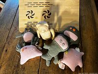 All items together: bamboo table behind plush toys and bear