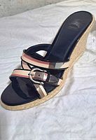 Side view of right Burberry espadrille wedge sandal showing Nova Check canvas, patent trim and jute heel