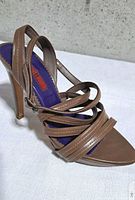 side view of right sandal showing straps, heel, colour and material