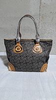 Front view of Celine Tourbillon Sulky tote showing pattern, handles, leather trim
