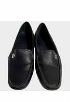 Top view of both loafers displaying pebble leather texture and logo hardware