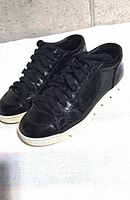 Pair of sneakers angled side view