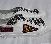 Side view of pair showing MIU MIU and Forever patches, sole detail