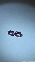 Pair of cushion-cut pink spinels side by side