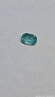 Front view of cushion cut emerald