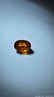 Front view of the oval cut spessartite garnet