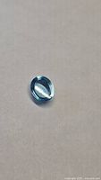 Front view of oval Swiss blue topaz cabochon