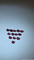 Full set of 14 rubies arranged in triangle formation