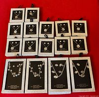 All 16 boxed jewelry sets displayed