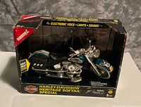 Front view of boxed Buddy L Harley-Davidson electronic motorcycle