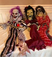 View of all three hanging props laid side by side on surface