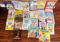 All 25 children’s books laid out in four rows