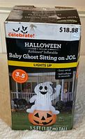 Front view of boxed Way To Celebrate! Baby Ghost Sitting on JOL inflatable showing product image and specs