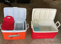 Both coolers open showing interiors and handles