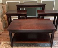 Front view of all four dark wood tables