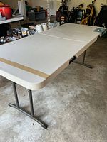 Table unfolded showing full length and leg style