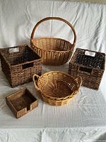Group shot of all five baskets displayed on cloth backdrop