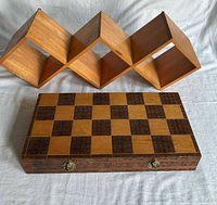 Cube wall shelf and closed chess case displayed together